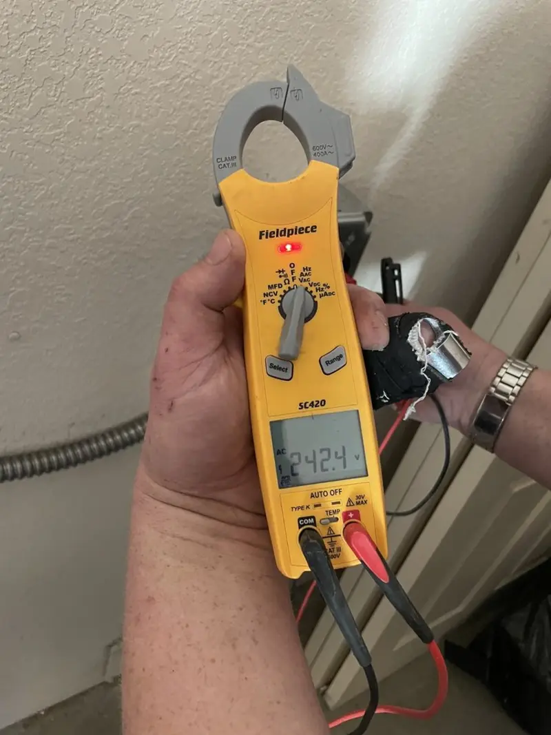 Voltage testing with clamp meter during Electrical Installation Services in Allamuchy